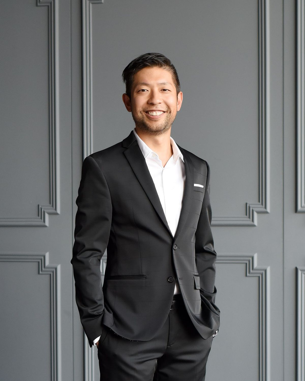 Kirby Chan, Broker, in a suit