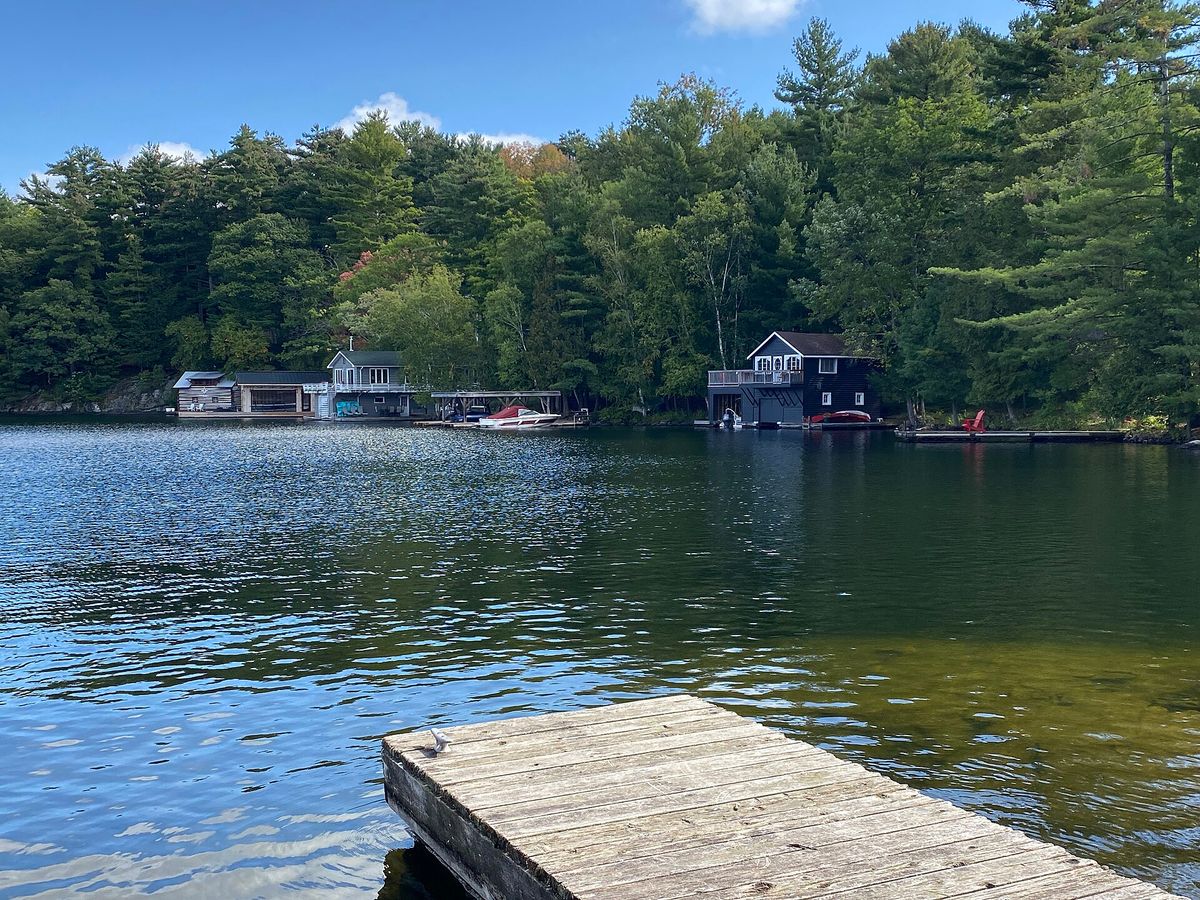 Boathouses and a dock on a Muskoka lake near Port Carling, Ontario.