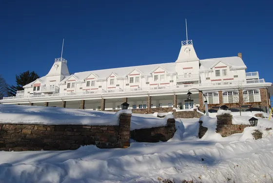 Windermere House, a white lakeside resort building, in Windermere, Ontario, in winter.